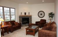 Sunken livingroom with stone fireplace